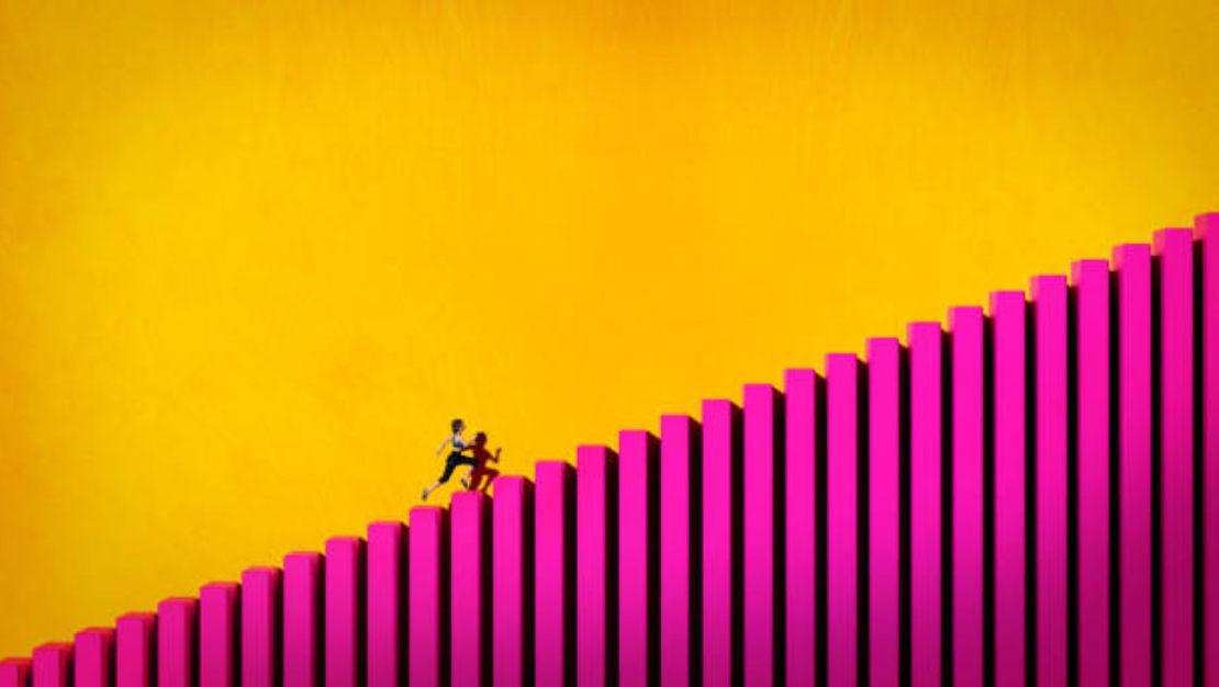 woman taking up the stairs to success